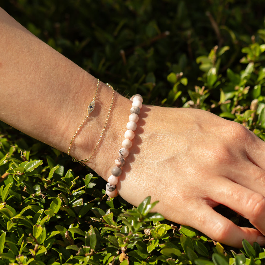 Pink Jasper bracelet worn with other bracelets