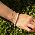 Pink Jasper bracelet worn with other bracelets