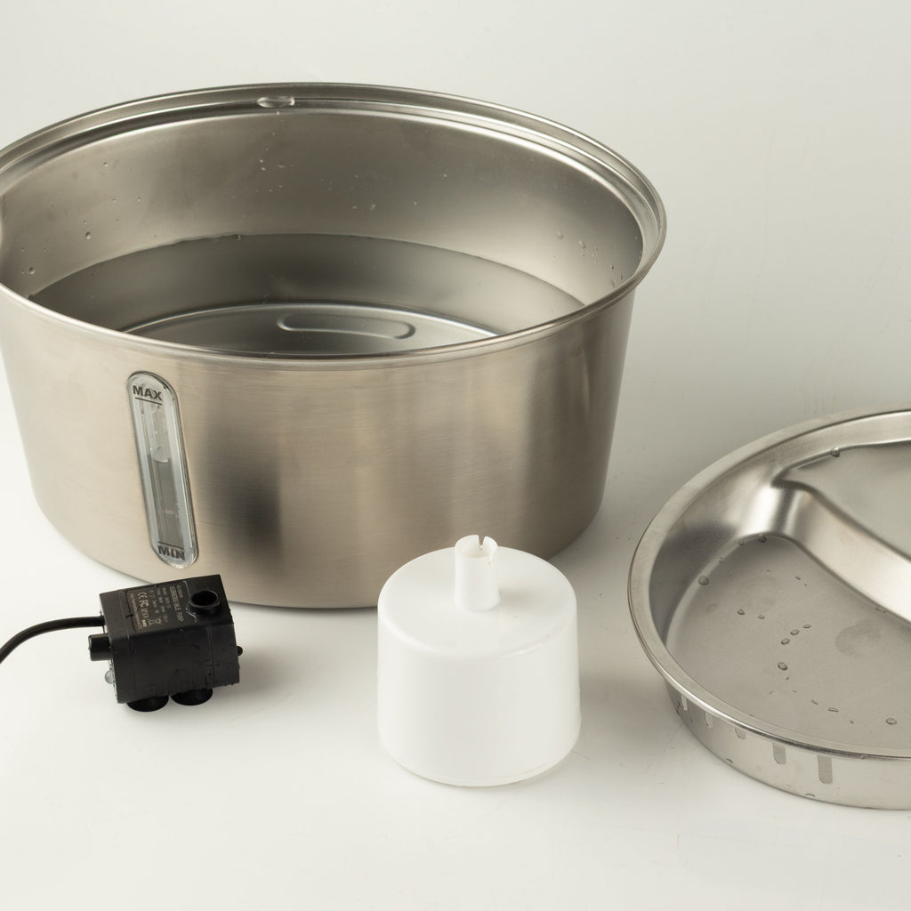 Fountain shown with its lid, pump and accessories