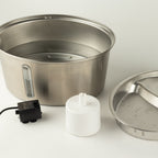 Fountain shown with its lid, pump and accessories