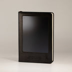 Upright black notebook showing its front screen and cover