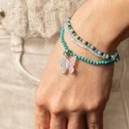 Three bracelets worn together on a wrist