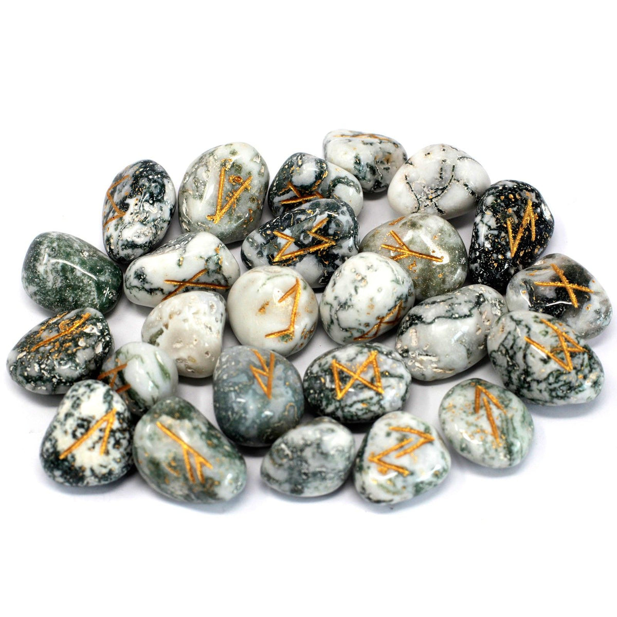 Tree agate rune stones spread out together on a white background, shown from above