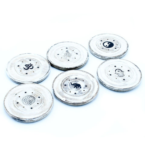 White Washed Incense Holder, Cone and Incense Disc, six round white discs with black symbols, viewed from above