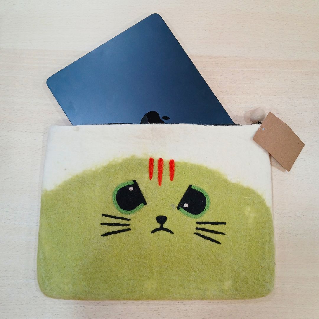 Unimpressed Cat pouch with a laptop partly inside