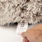 Care label shown beneath the bed