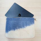 Blue Horizon pouch with a laptop partly inserted