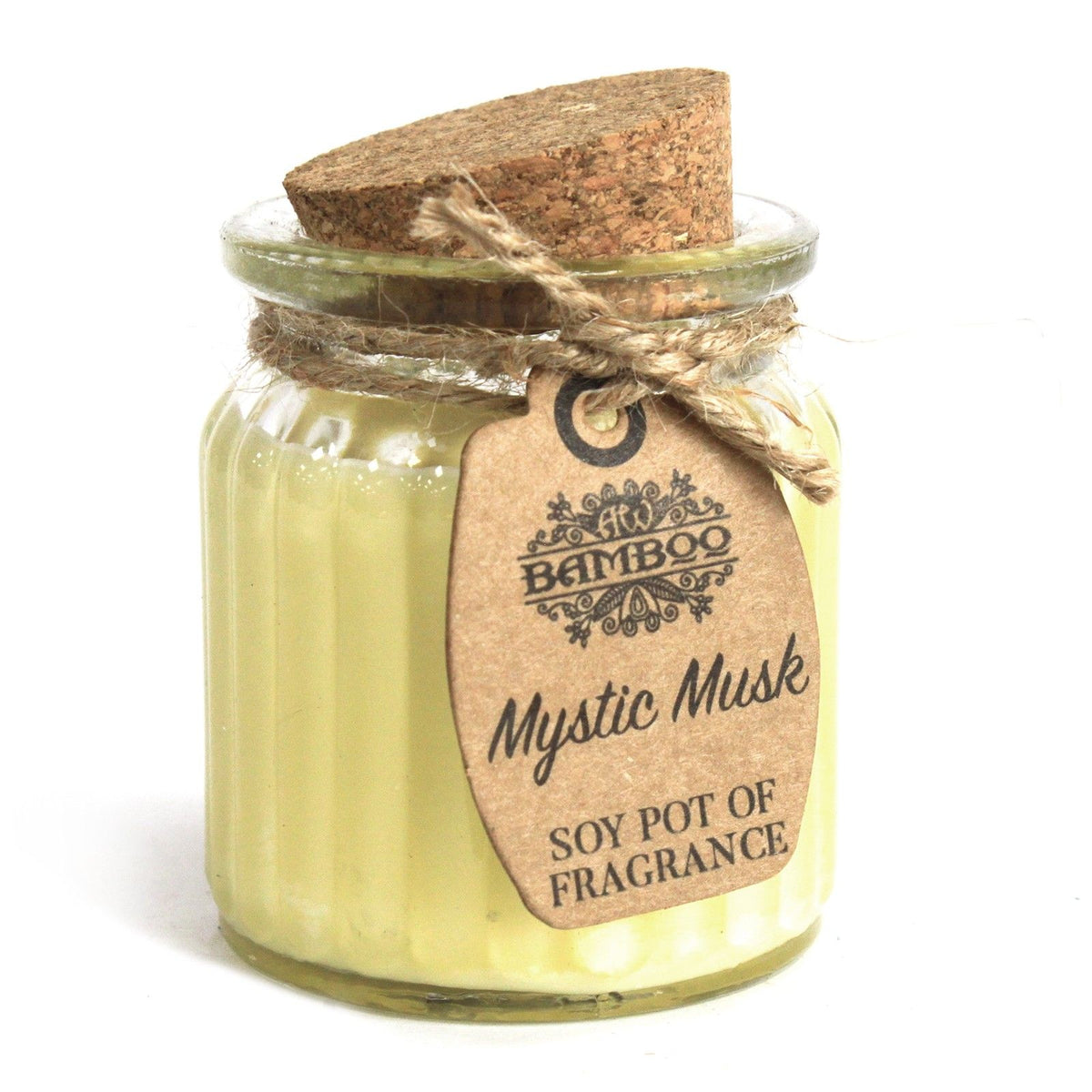 Mystic Musk candle in a close-up of its pale yellow wax, glass jar, cork lid and kraft paper tag