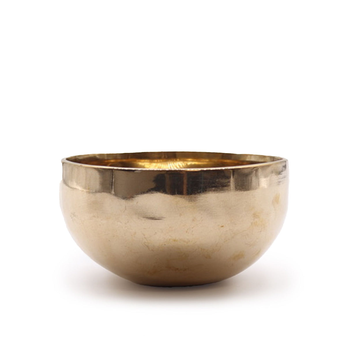 Singing bowl shown from the side against a plain white background, with a polished gold-toned rim