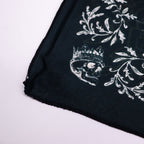 Close-up of the cloth edge and crowned skull illustration