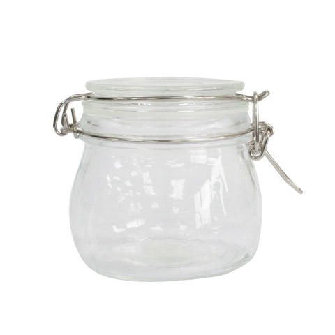 Empty clear glass Kilner jar with its lid and metal clasp closed, shown against white