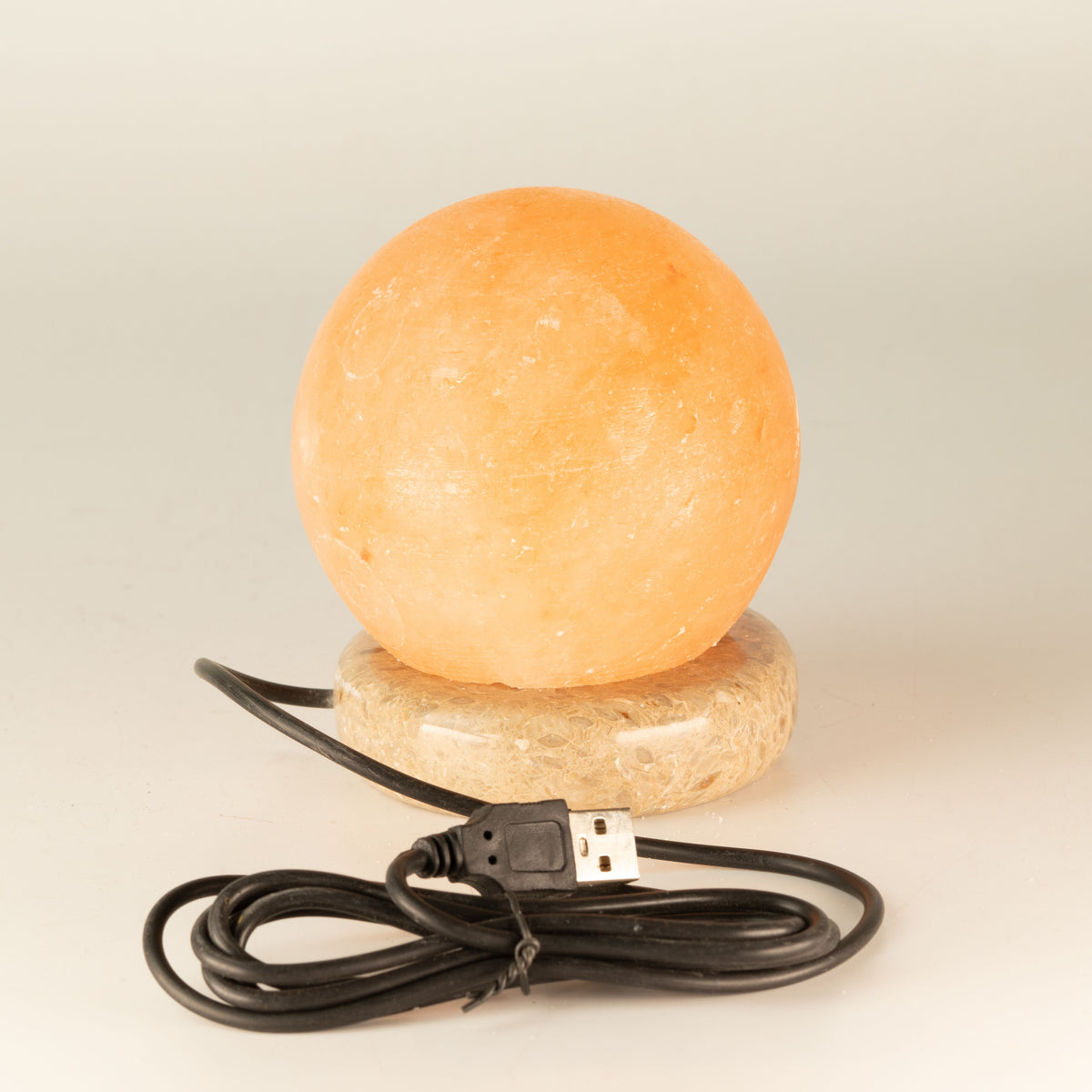 Quality USB Ball Salt Lamp, 8 cm, glowing orange sphere on a round base with coiled USB cable