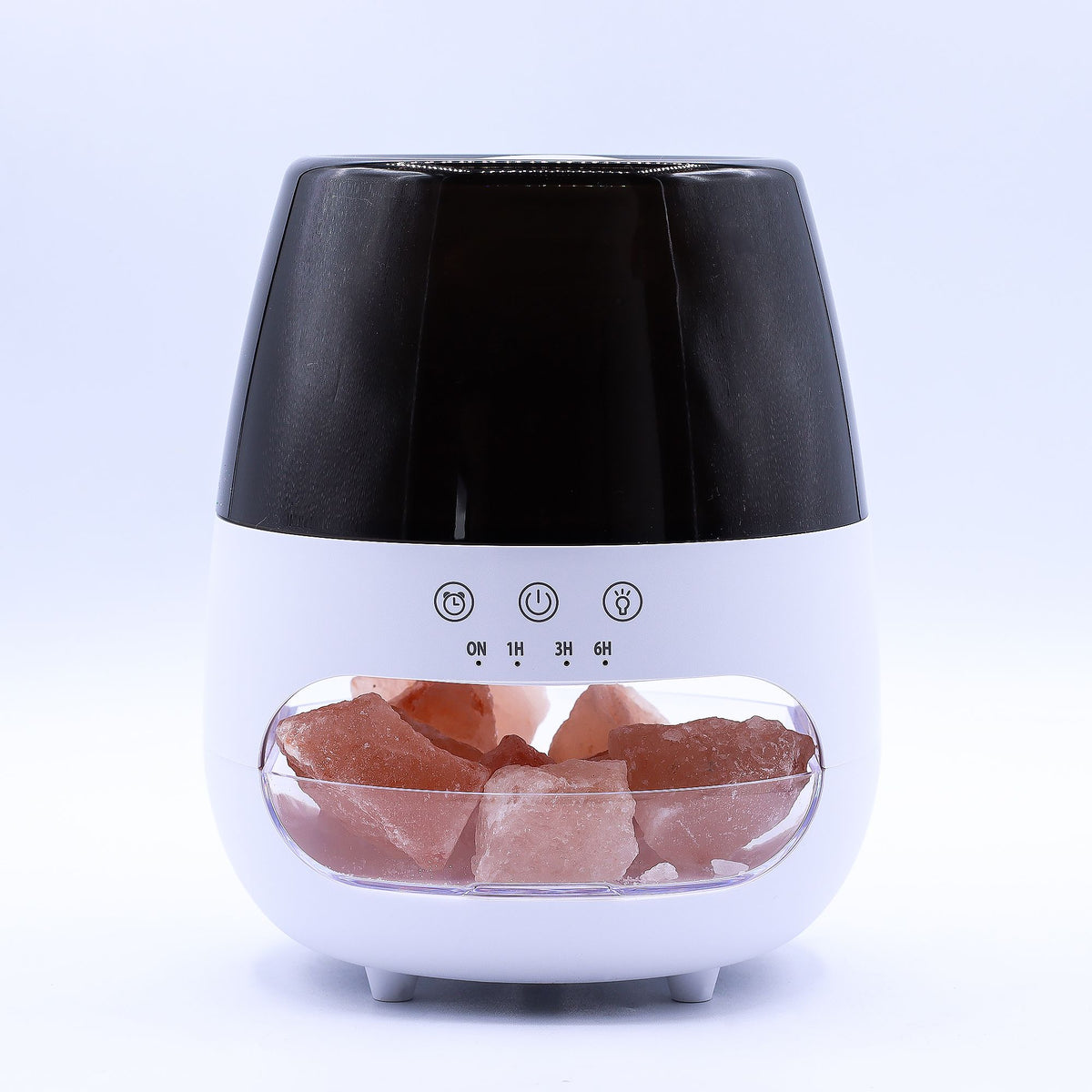 Front view of the white diffuser with black top, pink stones and timer controls visible