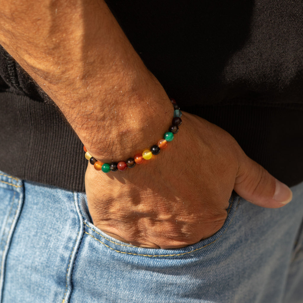 Bracelet worn at the wrist with a hand in a pocket