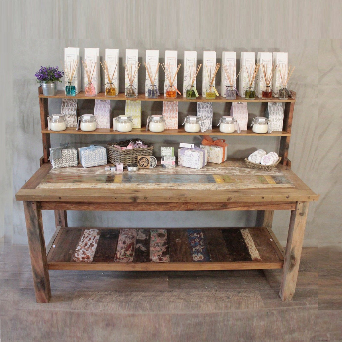 A&C 1.8m Standard Table with top shelf, front view in a shop display with products on the shelves