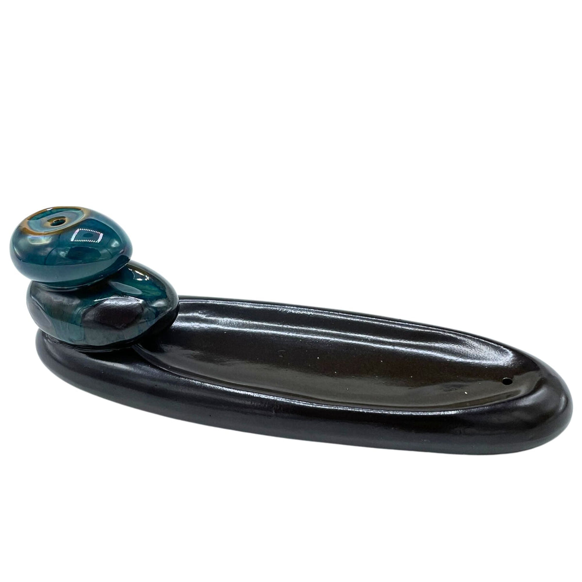 Backflow Incense Burner, Zen Pebbles Classic, black oval dish with two glossy teal pebbles on a white background