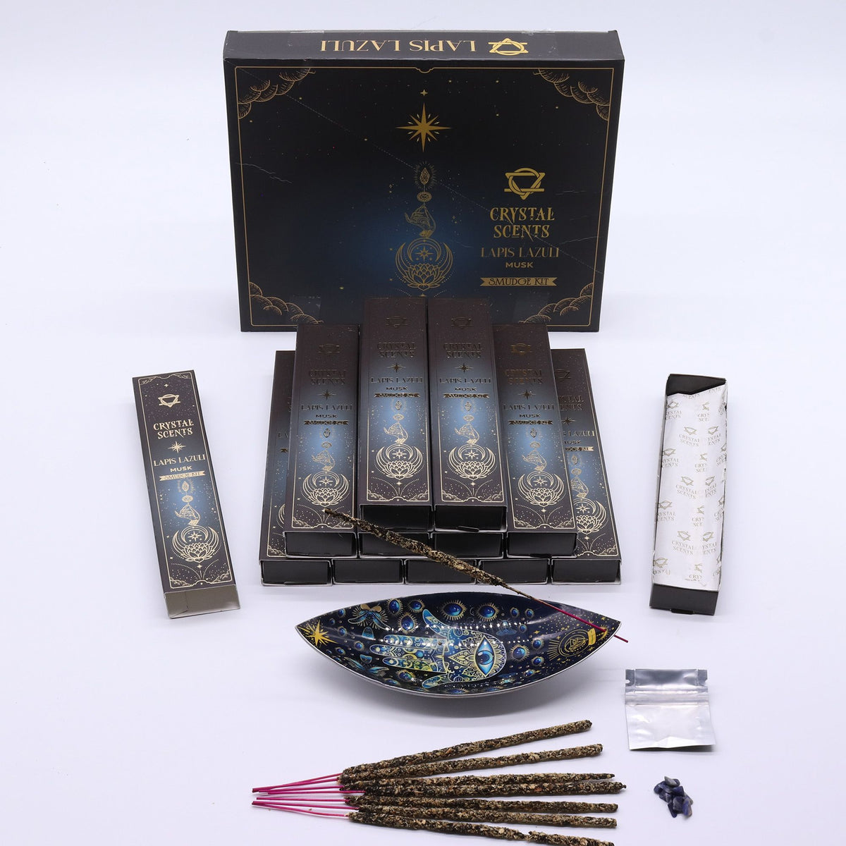 Lapis Crystal Scents Smudge Incense, Musk displayed with its box, incense sticks, a dish and small accessories