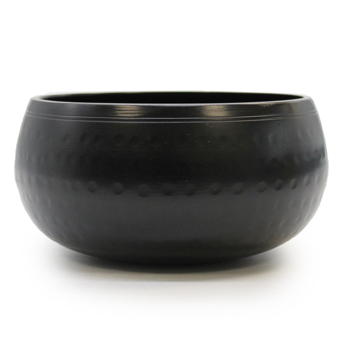 Black beaten singing bowl shown alone from the front, with its open rim visible