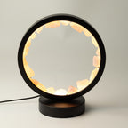 Zen Body rose quartz halo lamp glowing in a black circular frame