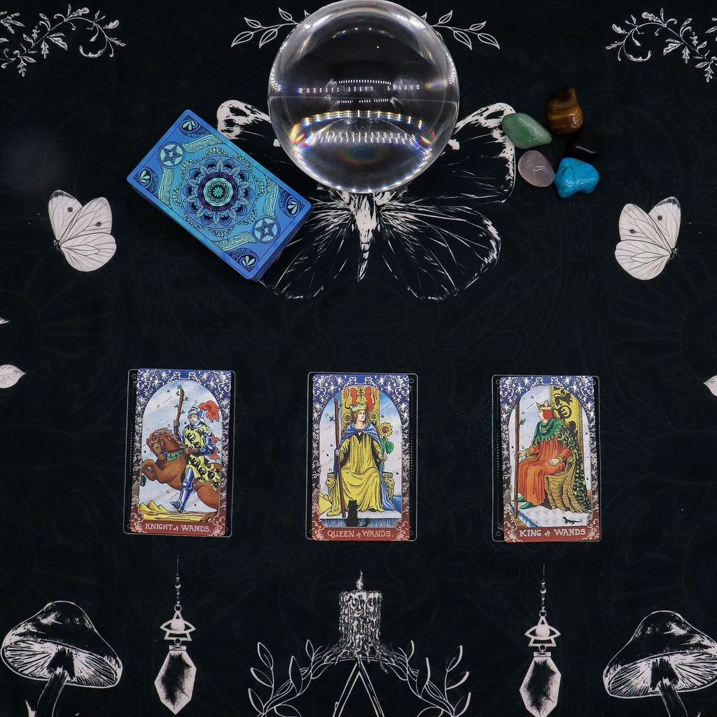 Tarot spread arranged on the patterned reading cloth