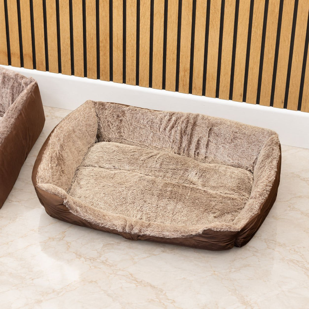 Close view of the plush bed's raised sides and sleeping surface