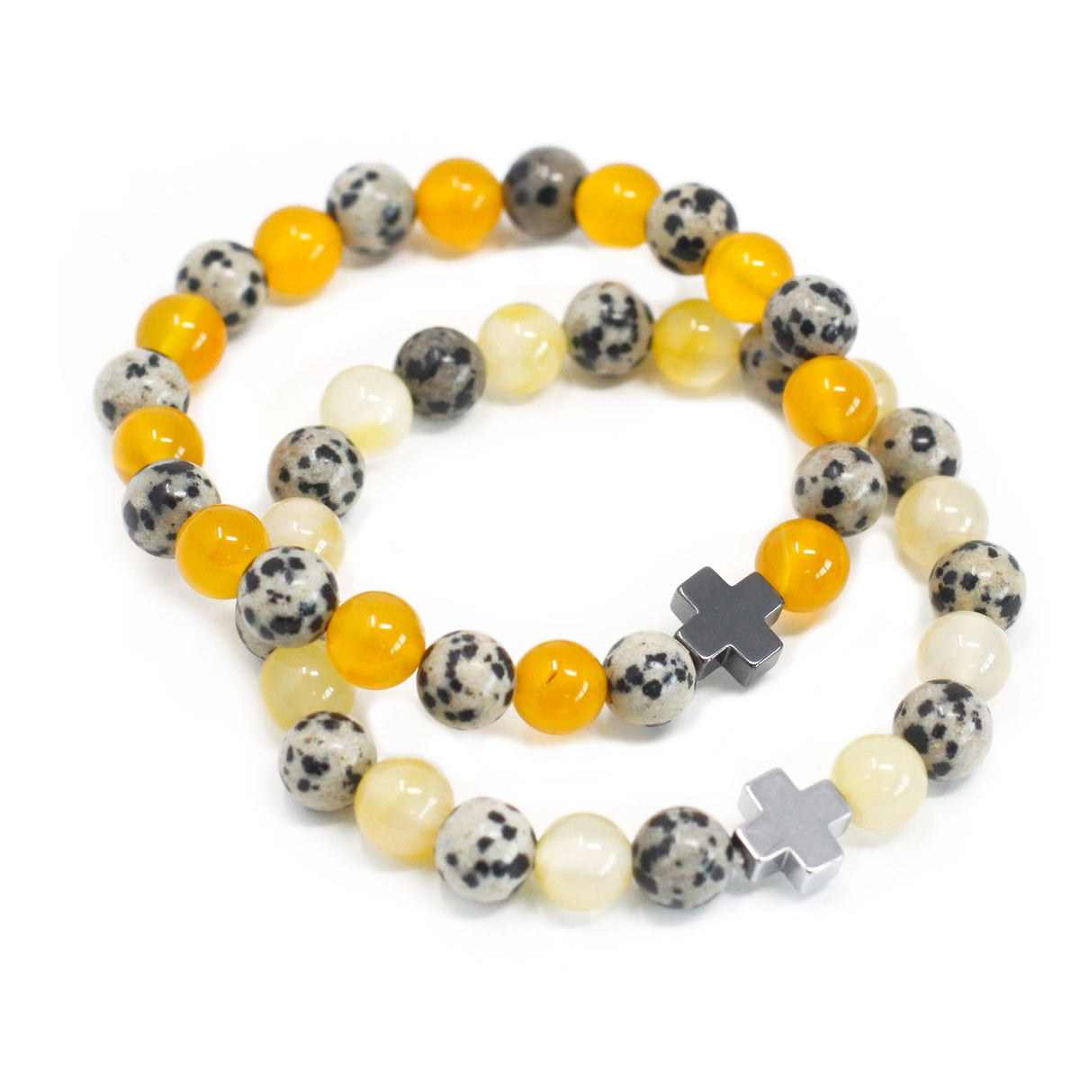 Two friendship bracelets with spotted, yellow and pale beads