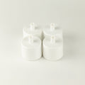 PAW water fountain replacement filters, four white filters grouped together