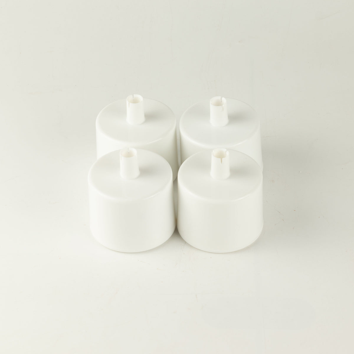 PAW water fountain replacement filters, four white filters grouped together