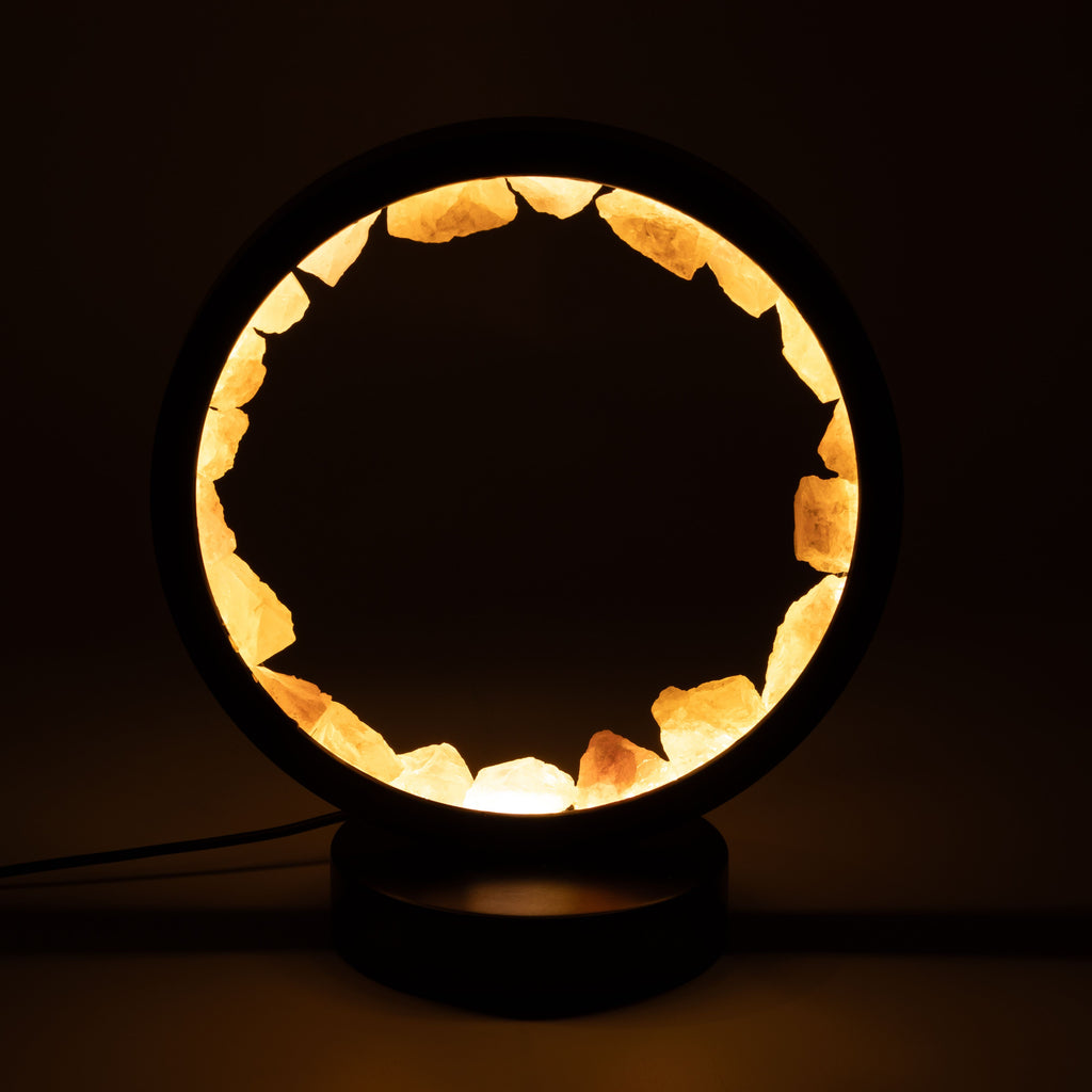 Rose quartz halo lamp glowing against a dark background