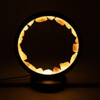 Rose quartz halo lamp glowing against a dark background