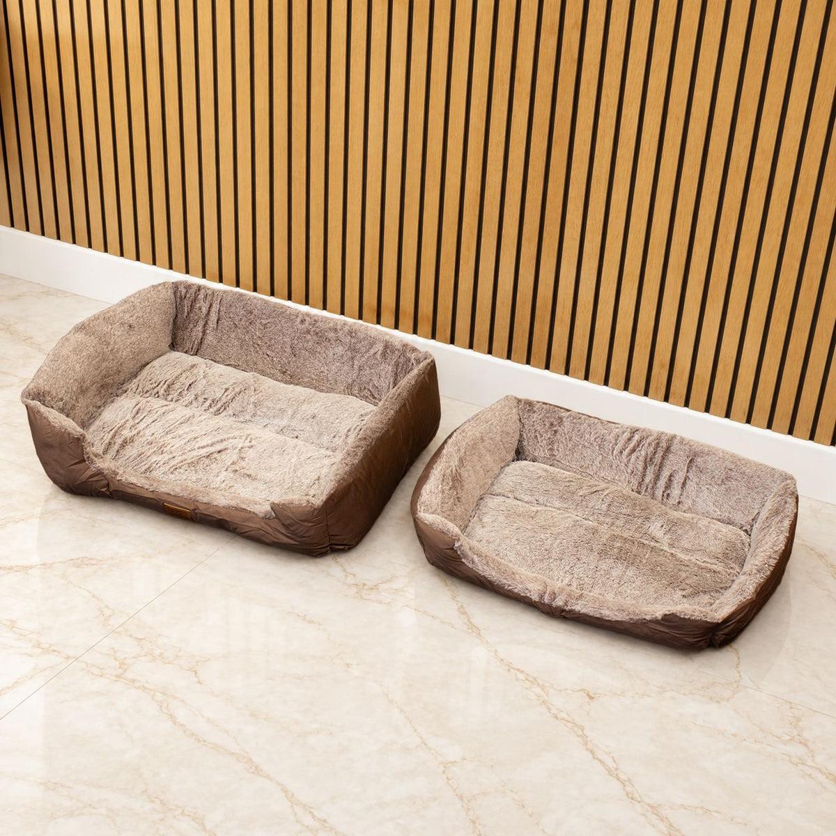 Two brown pet beds shown side by side