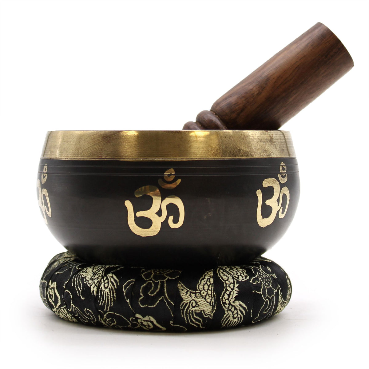 Yoga Om Singing Bowl Set, black and gold bowl on a patterned cushion with wooden striker