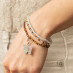 Three bracelets worn together on a wrist