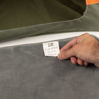 Close-up of the bed’s cushion and care label