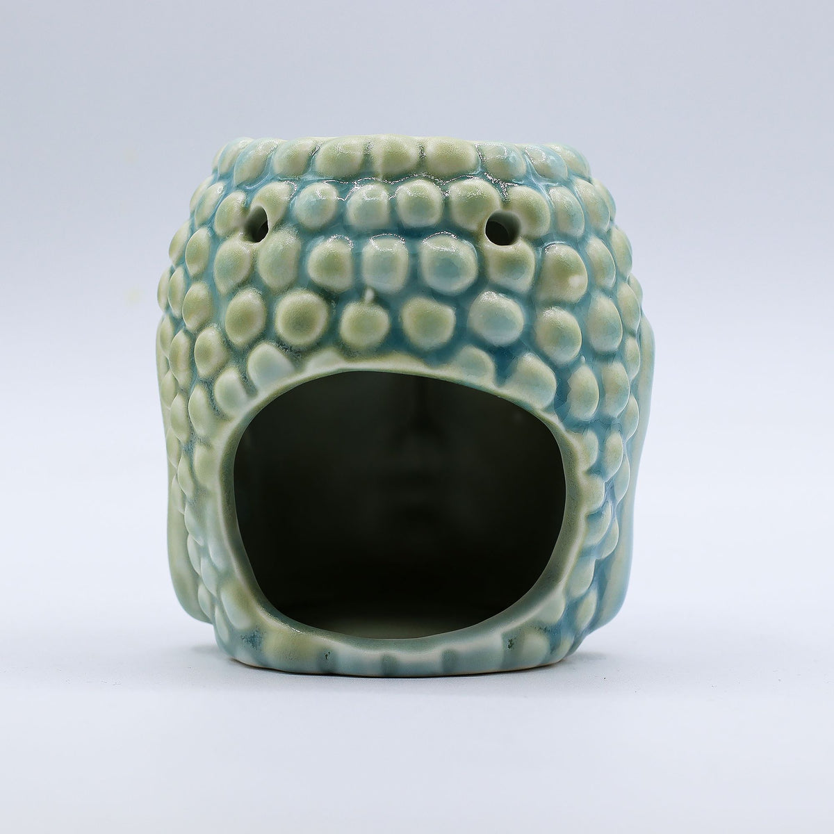 Buddha Oil Burner, Blue, textured rounded back with two air holes and a large opening, front view