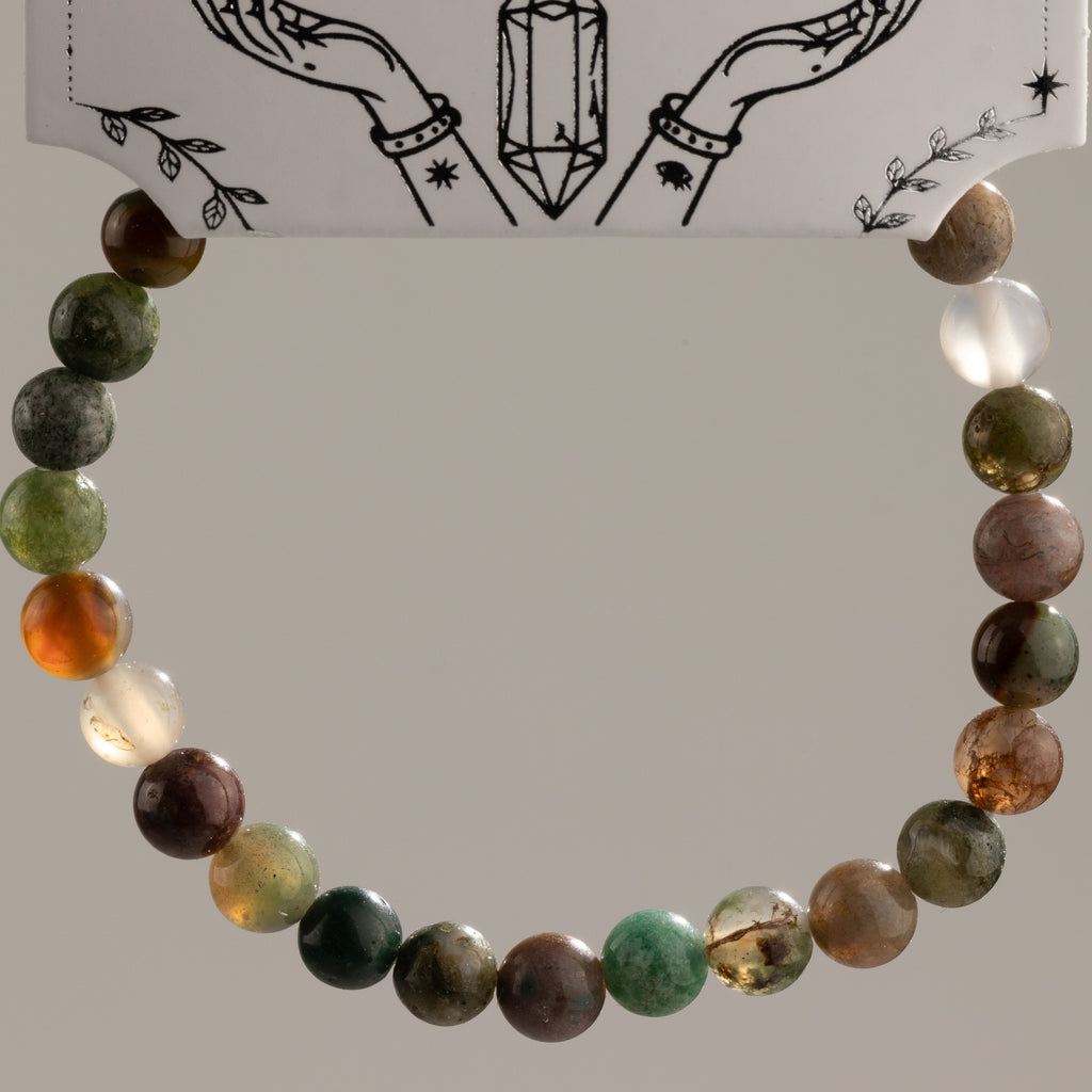 Moss Agate bracelet arranged in a circle to show the varied bead patterns