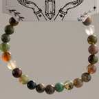 Moss Agate bracelet arranged in a circle to show the varied bead patterns