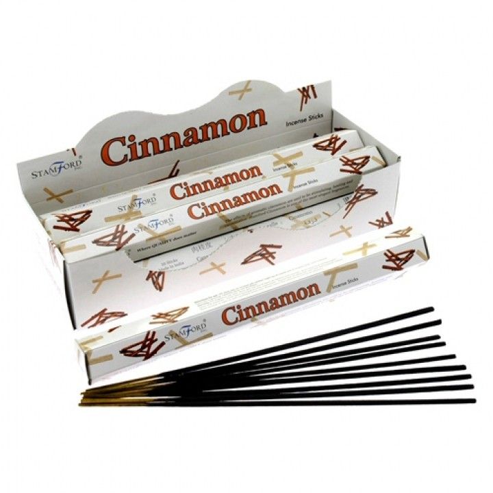 Cinnamon Premium Incense in an open white Stamford box, with black incense sticks laid out in front