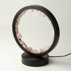 Unlit rose quartz pieces set around the circular frame