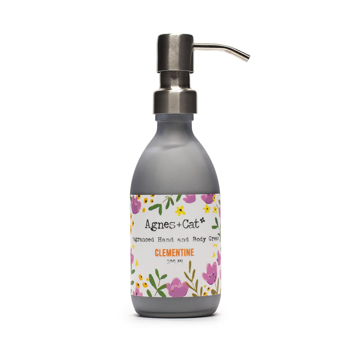Agnes + Cat Hand & Body Cream, Clementine, grey pump bottle with a floral label on white