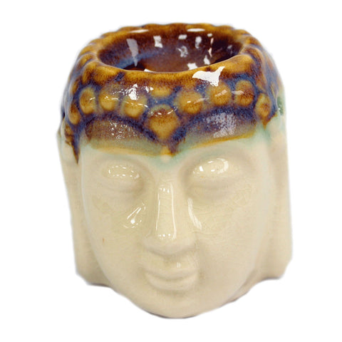 Close-up front view of the Buddha oil burner, showing its open bowl and glossy patterned crown
