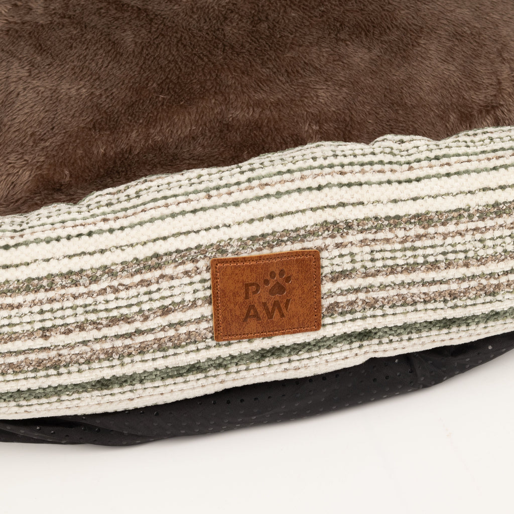 Close-up of the bed’s front fabric and label