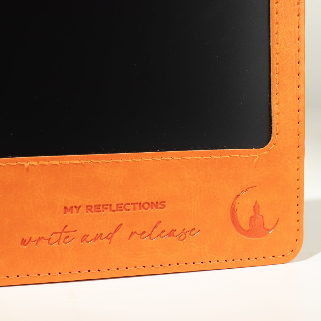 Close-up of the orange cover wording and embossed design