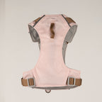 Back view of the pink harness with its straps and lead ring