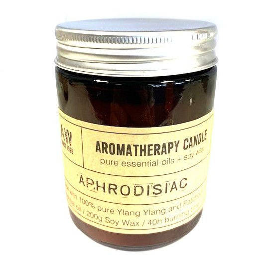 Aromatherapy Candle, Aphrodisiac in a brown glass jar with a silver lid and cream label