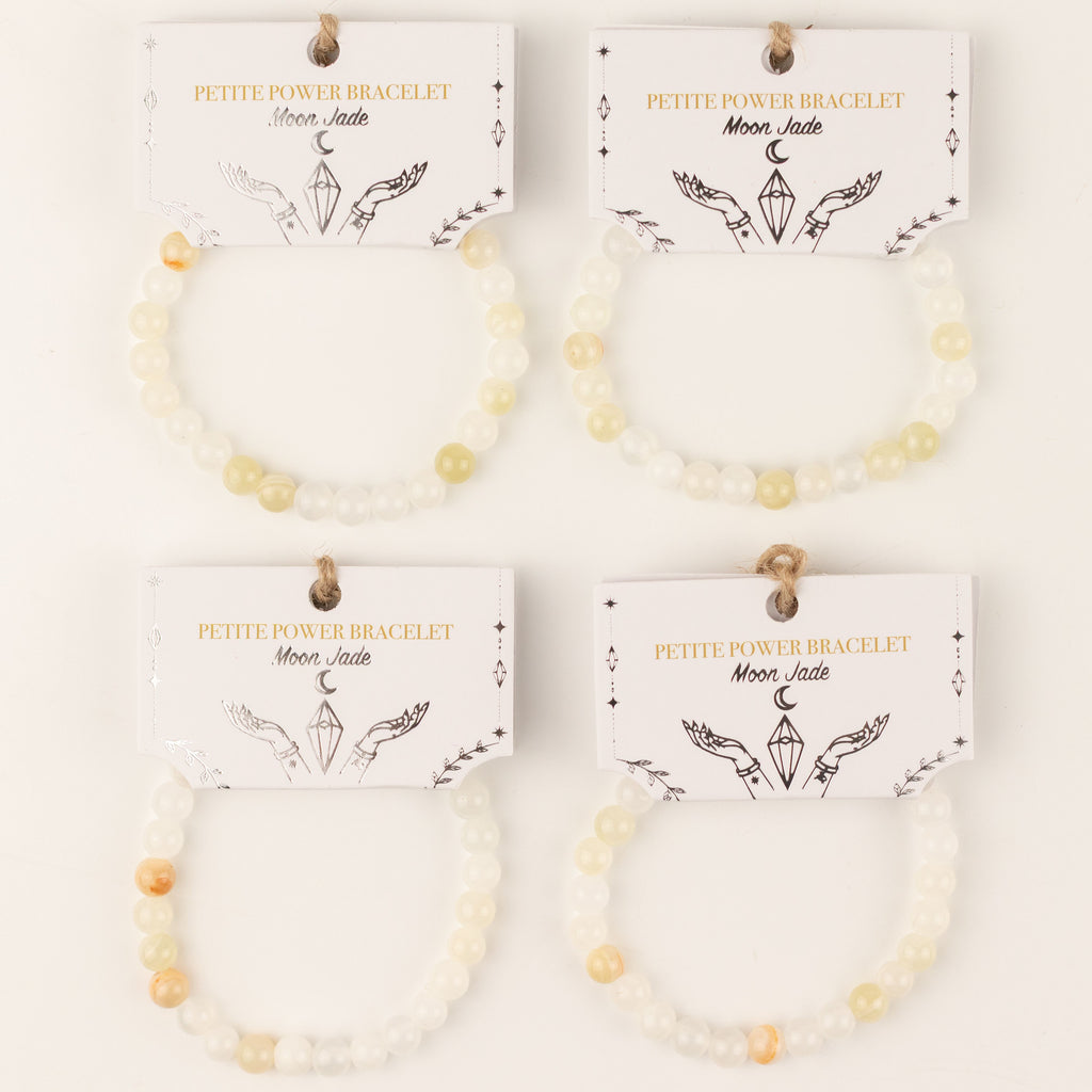Four bracelets with illustrated presentation cards