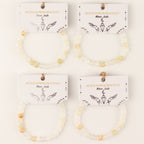 Four bracelets with illustrated presentation cards