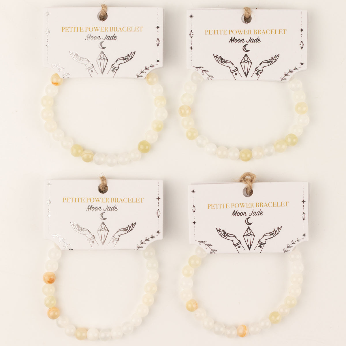 Four bracelets with illustrated presentation cards