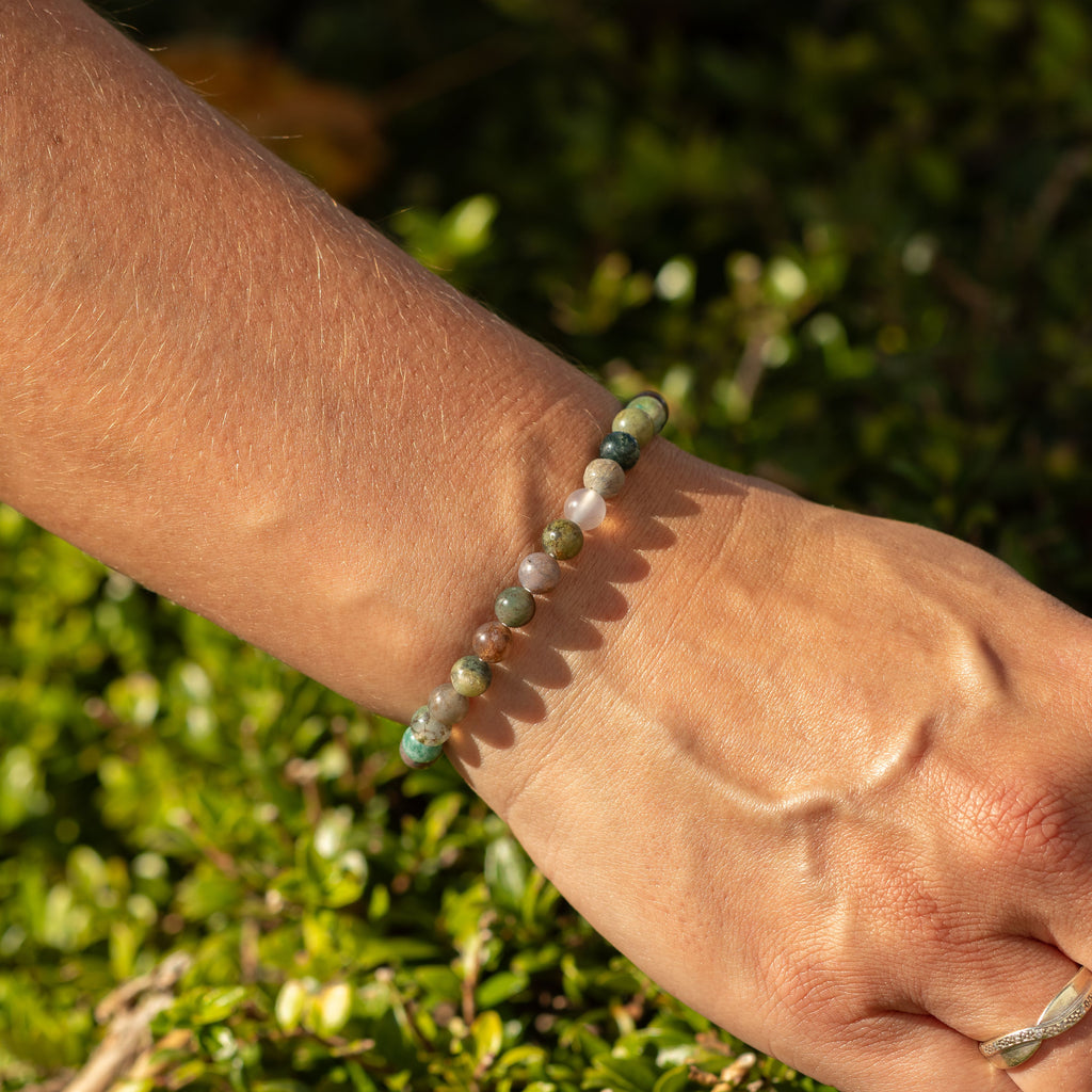 Close view of the Moss Agate bracelet on a wrist