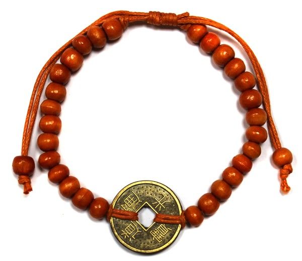 Orange bracelet with round wooden beads and a circular centre detail
